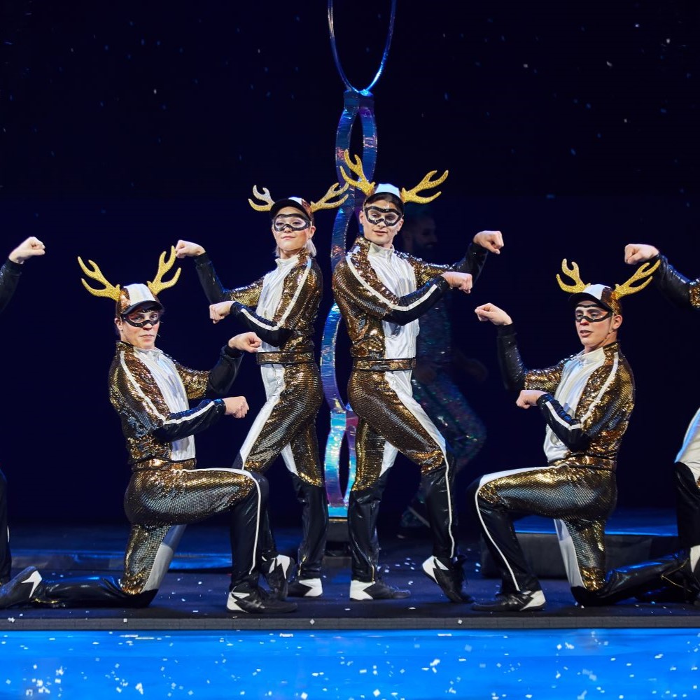 Performers dressed as sparkly reindeer